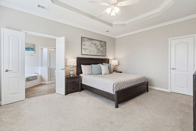 carpeted bedroom featuring ceiling fan, crown molding, and a raised ceiling