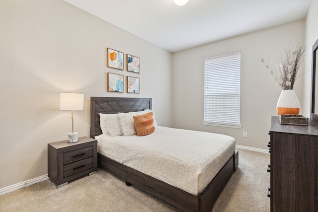 bedroom featuring light colored carpet