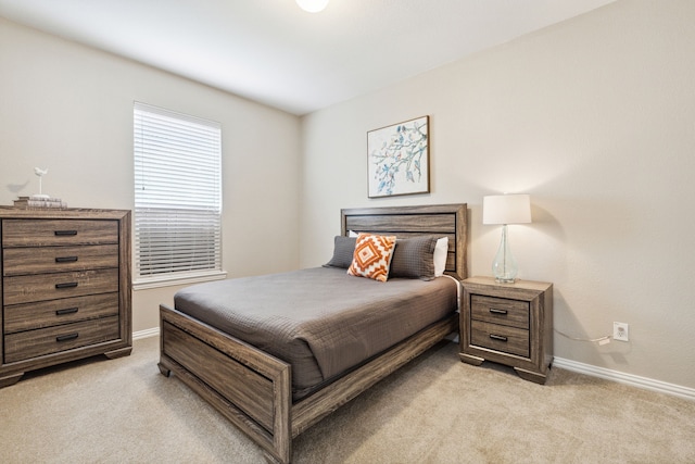 bedroom featuring light carpet