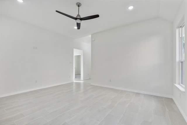 spare room with vaulted ceiling, ceiling fan, recessed lighting, and baseboards