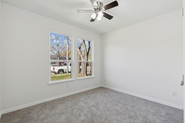 empty room with ceiling fan and carpet floors