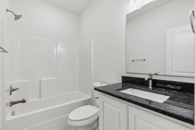 full bathroom with vanity, toilet, and washtub / shower combination