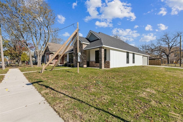 view of side of home with a lawn