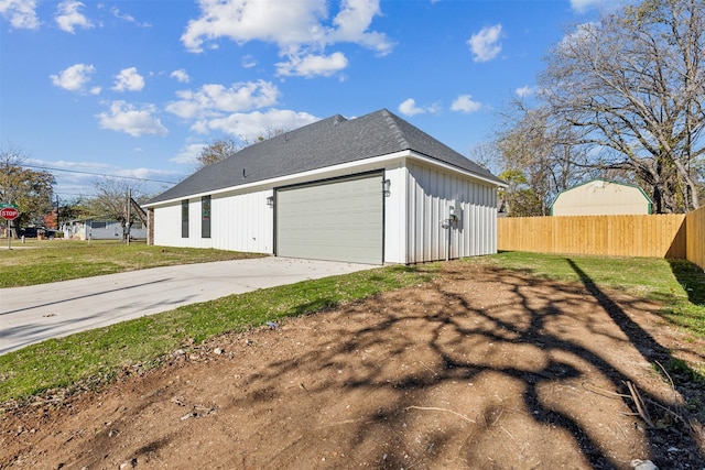 view of property exterior with a garage and a lawn