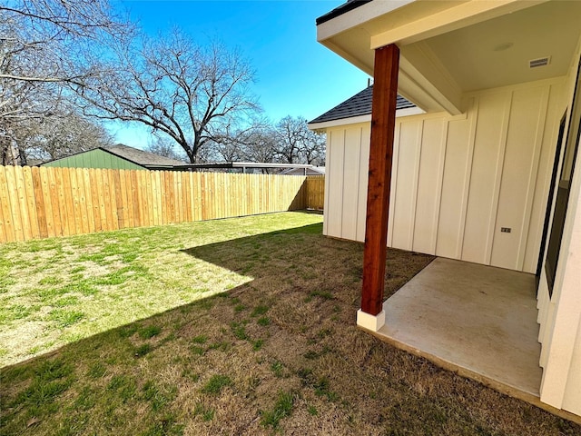 view of yard featuring a fenced backyard and visible vents