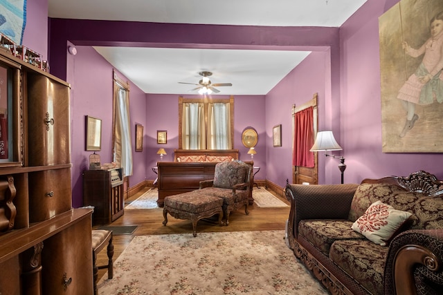 sitting room featuring ceiling fan and light hardwood / wood-style flooring