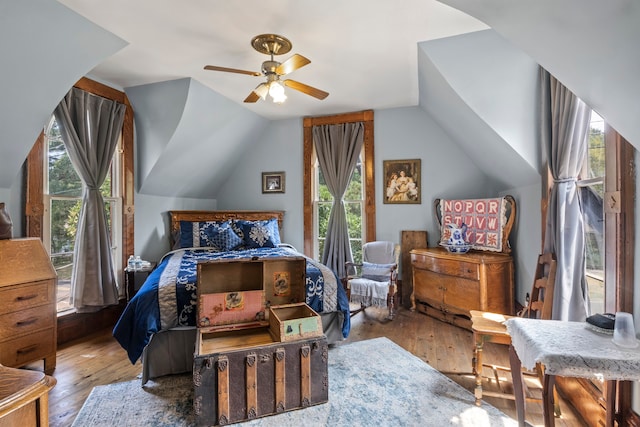 bedroom with lofted ceiling, light hardwood / wood-style floors, and ceiling fan