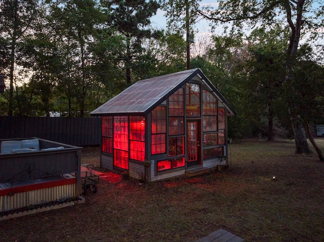 view of outdoor structure at dusk