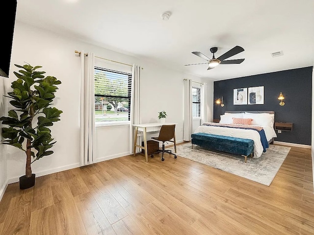 bedroom featuring light wood-type flooring and ceiling fan