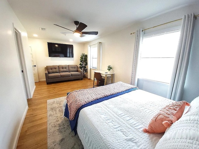 bedroom featuring hardwood / wood-style flooring and ceiling fan