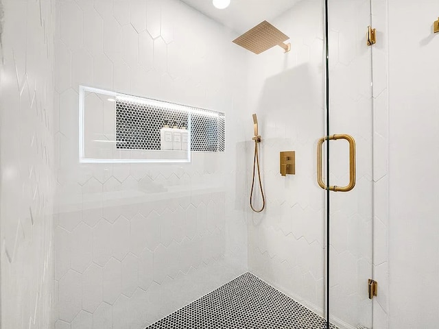 bathroom with a shower with shower door