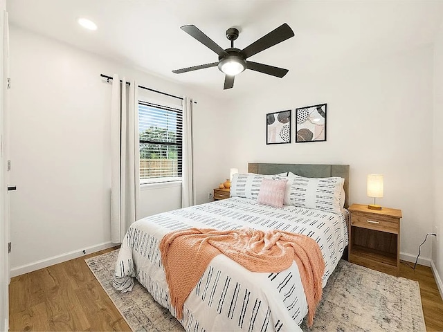 bedroom featuring ceiling fan and light wood-type flooring