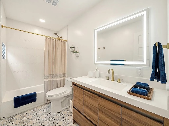 full bathroom with shower / tub combo, vanity, and toilet