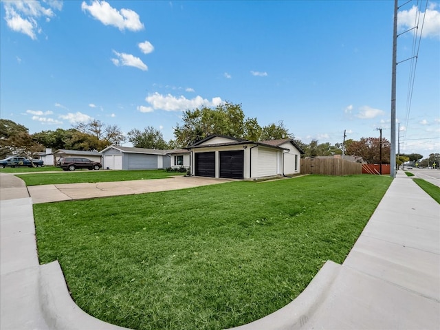 view of front of home featuring a garage and a front yard