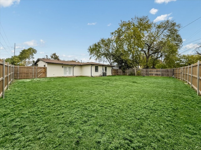 view of yard with french doors