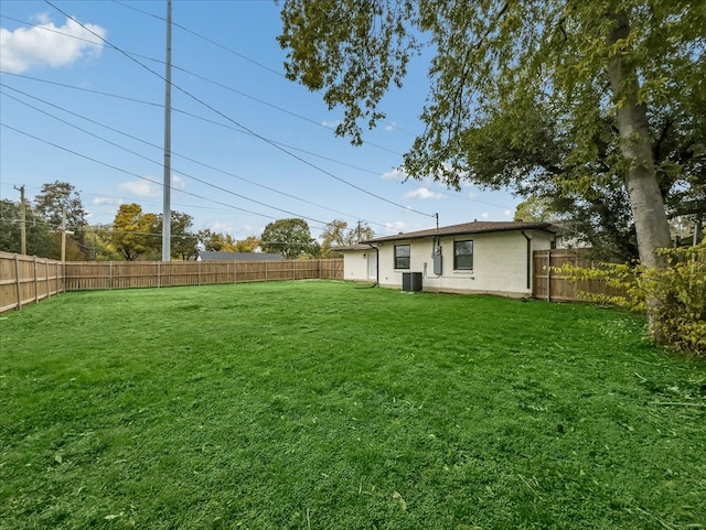 view of yard with central AC