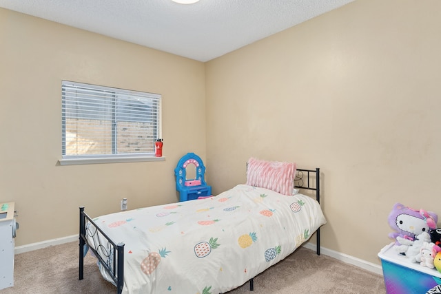 bedroom with carpet and a textured ceiling