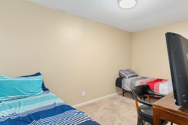 carpeted bedroom with a textured ceiling