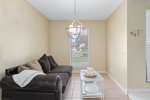 living room with a notable chandelier and light tile patterned floors