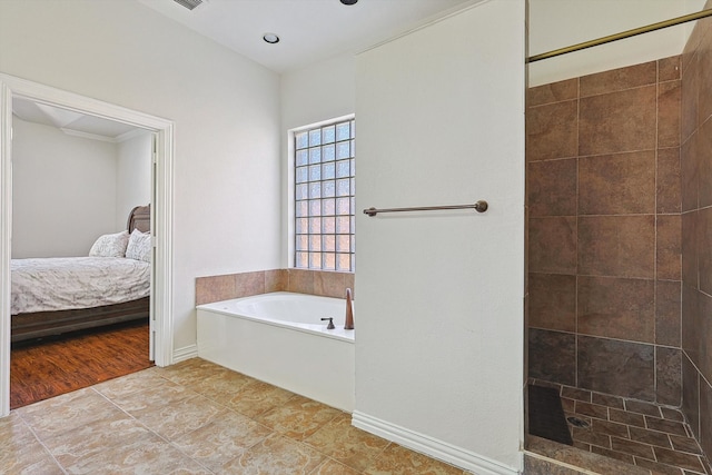 bathroom featuring hardwood / wood-style floors and shower with separate bathtub