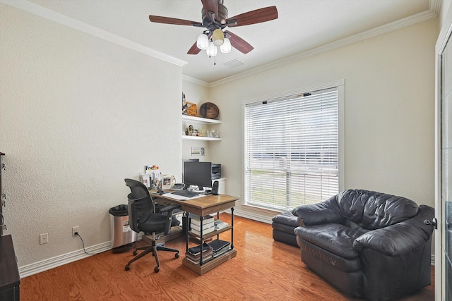 home office with hardwood / wood-style flooring, ceiling fan, and crown molding