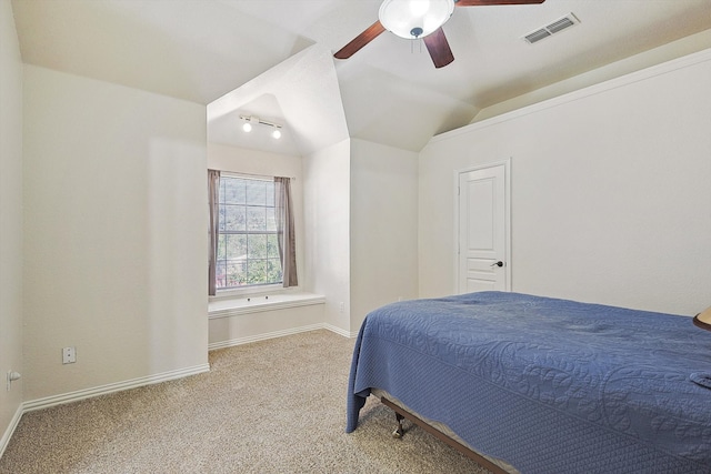 bedroom featuring ceiling fan, light colored carpet, and vaulted ceiling