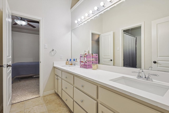 bathroom with tile patterned floors, vanity, and ceiling fan