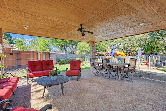 view of patio with ceiling fan and an outdoor living space