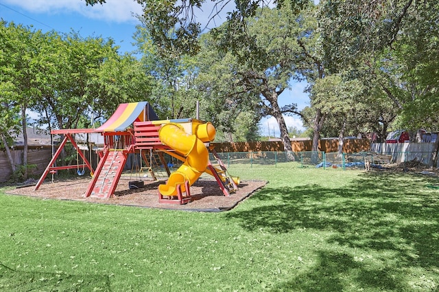 view of jungle gym with a lawn