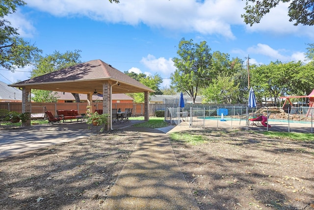 surrounding community featuring a gazebo and a pool