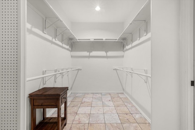 empty room featuring light wood-type flooring and ceiling fan