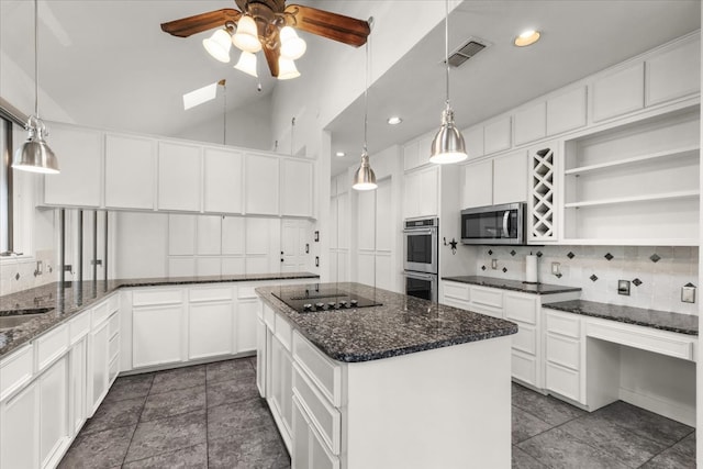 kitchen featuring a kitchen island, hanging light fixtures, dark stone counters, stainless steel fridge with ice dispenser, and white cabinetry