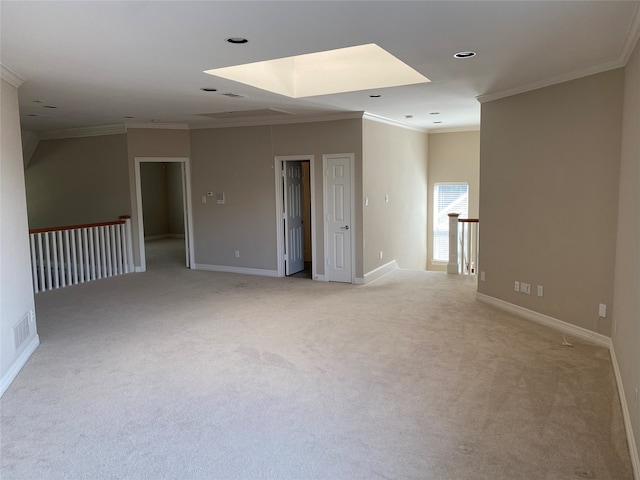 carpeted spare room with crown molding