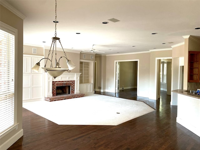 unfurnished living room with ornamental molding, dark wood-type flooring, and a brick fireplace