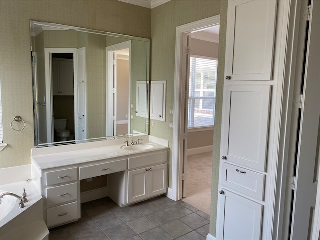 bathroom featuring vanity, crown molding, a washtub, and tile patterned flooring