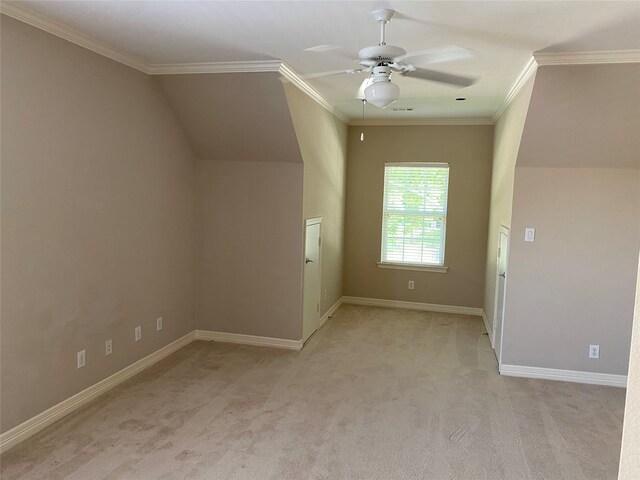 additional living space with light colored carpet, vaulted ceiling, and ceiling fan