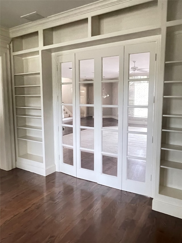 doorway featuring ceiling fan, built in features, and dark hardwood / wood-style floors