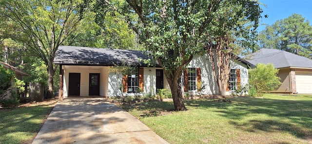 view of front of home featuring a carport, a front lawn, and a garage