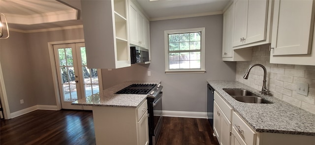 kitchen featuring a healthy amount of sunlight, appliances with stainless steel finishes, light stone counters, and white cabinets