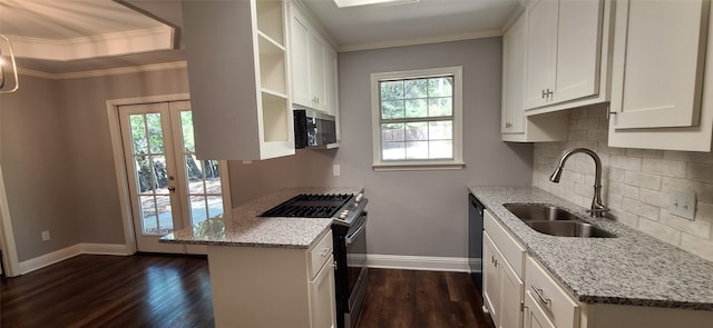 kitchen featuring light stone countertops, white cabinets, stainless steel appliances, and dark hardwood / wood-style flooring