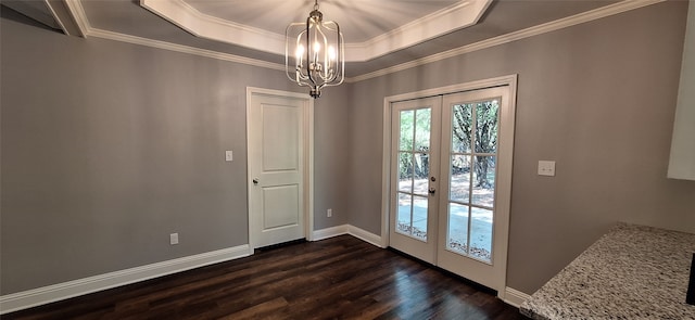 doorway to outside with french doors, a tray ceiling, dark wood-type flooring, and crown molding