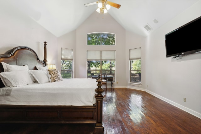 bedroom with ceiling fan, multiple windows, high vaulted ceiling, and dark hardwood / wood-style flooring