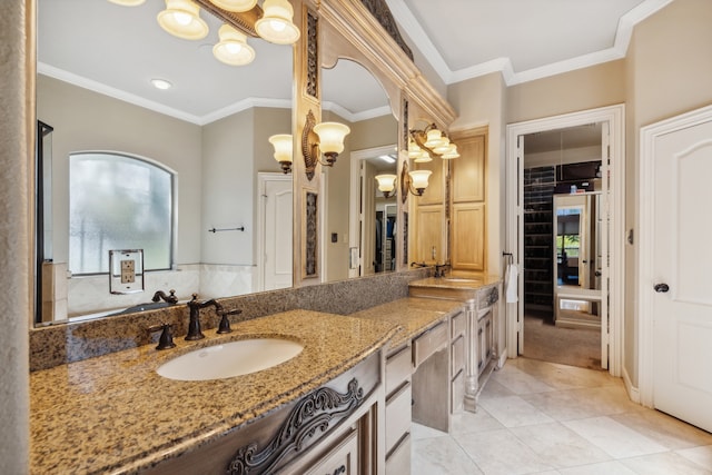 bathroom with vanity, ornamental molding, and tile patterned floors