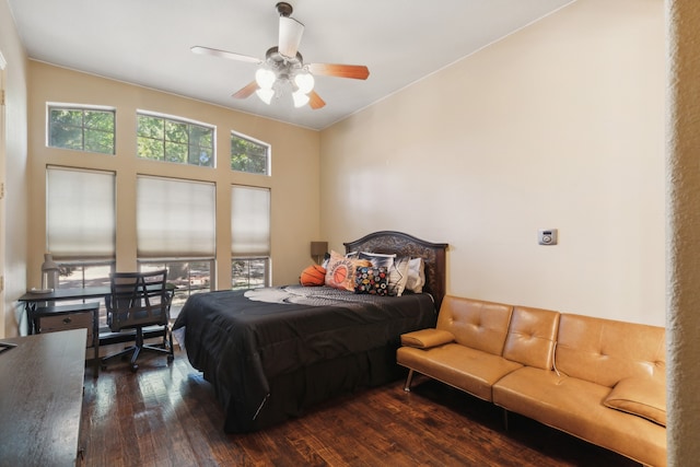 bedroom featuring ceiling fan and dark hardwood / wood-style floors