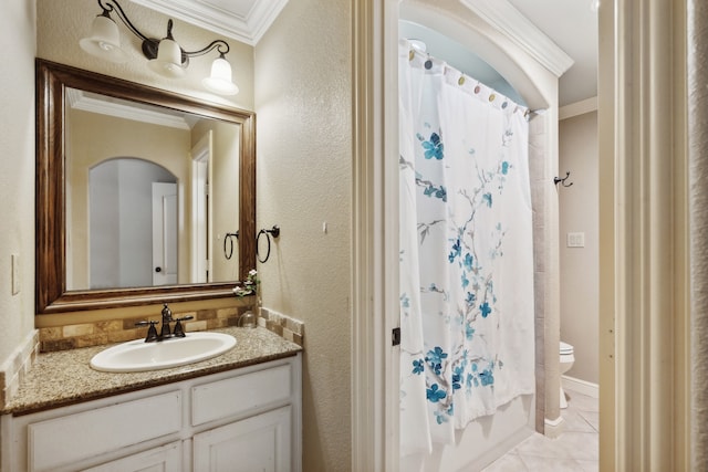 bathroom with toilet, crown molding, vanity, and tile patterned flooring