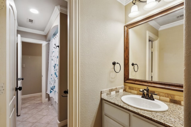 bathroom with vanity, ornamental molding, walk in shower, and tile patterned flooring