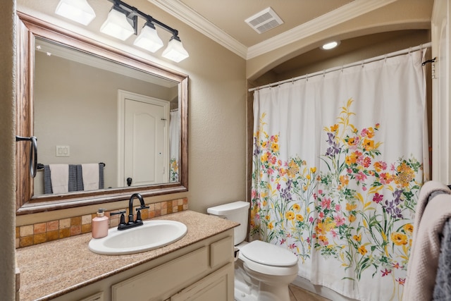 bathroom with toilet, ornamental molding, and vanity