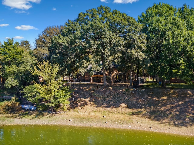 rear view of property featuring a water view