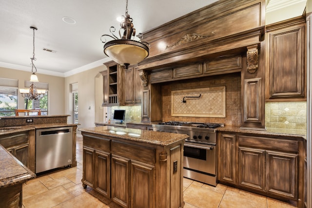 kitchen with decorative backsplash, a chandelier, stainless steel appliances, decorative light fixtures, and a center island