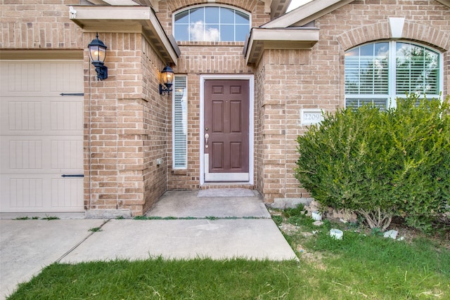 doorway to property featuring a garage